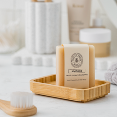 Soothing natural Jarrah honey and goats milk honey in a clean neat bathroom. 