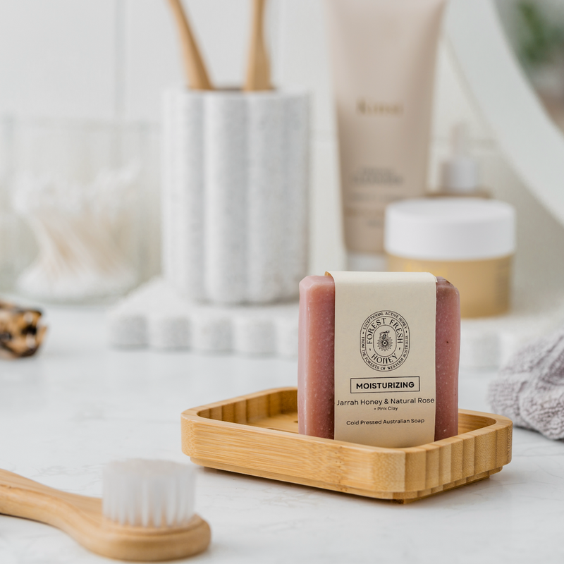 Moisturizing natural Jarrah honey and natural rose and pink clay soap in a clean neat bathroom. 
